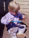 Anna_Playing_In_Dirt2_April02.jpg (48357 bytes)