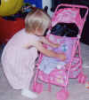 Anna_PuttingDoll_InStroller_June02.jpg (34712 bytes)