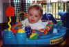 Anna_exersaucer_5mOld.jpg (29320 bytes)