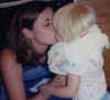 Mommy_kissing_Anna_Aug02.jpg (52481 bytes)
