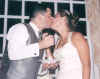 WMwedding_BrideGroomKiss.jpg (115080 bytes)